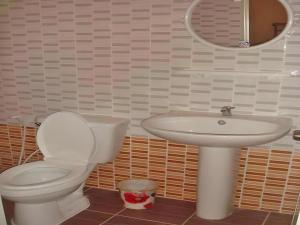 a bathroom with a toilet and a sink at Thorfan Resort in Ban Nong Waeng +71 photos