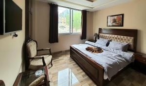 Giường trong phòng chung tại Qayam Hotel & Apartments