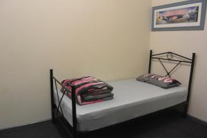 Postel nebo postele na pokoji v ubytování Elizabeth Hostel