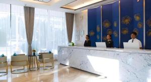 Členové personálu v ubytování GreenTree Eastern Dali Railway Station Hotel