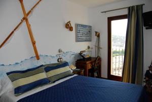 Postel nebo postele na pokoji v ubytování Hostal La Garita