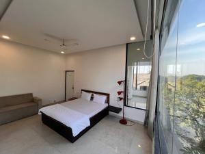 Postel nebo postele na pokoji v ubytování Hotel Golden Leaf + 4 fotografie