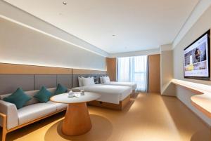 En eller flere senge i et værelse på JI Hotel Nanjing National Agricultural Innovation Center