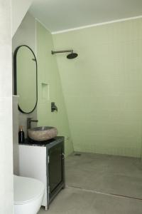 a bathroom with a sink and a mirror at Triangle Valley in Ooty