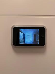 a cell phone is attached to a wall at Maritime Suite an der Geeste in Bremerhaven +2 photos