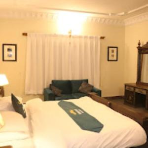 En eller flere senge i et værelse på Musketeers Resort + 10 billeder