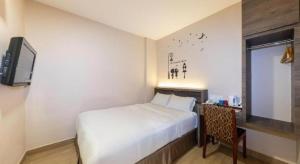 Телевизор и/или развлекательный центр в Sunlight Hotel Kulai +132 фотографии