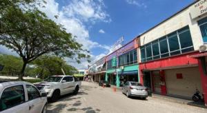 a street with cars parked in front of a building at OYO 89752 7 DAYS EXPRESS HOTEL in Air Hitam +46 photos