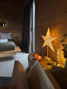 a bedroom with a bed and a star on the wall at Shepit space in Slavske