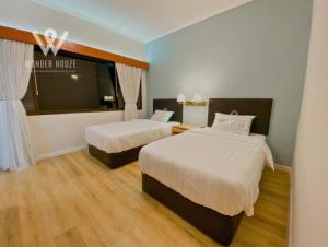 Una cama o camas en una habitación de Cozy Highlands Escape at Copthorne Cameron Highlands 30 fotos más