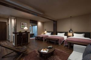 Ένα ή περισσότερα κρεβάτια σε δωμάτιο στο LAKHAM DAR. YuYueju Boutique Stay +153 φωτογραφίες