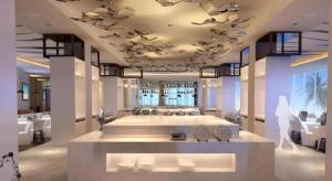 a large bathroom with a large bath tub with sinks at Wyndham Garden Hotel in Lingshui