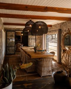 a dining room with a table and some chairs at Twyfelberg Karoo Hideaway in Britstown