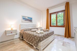 Ένα ή περισσότερα κρεβάτια σε δωμάτιο στο Appartamento Le Pavoncelle