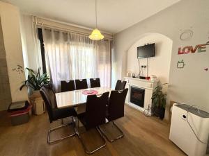 a living room with a dining room table and chairs at Marina Gloria in Zadvorsko