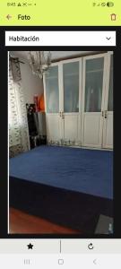 a picture of a room with a blue bed at villa Amparo in Villaviciosa de Odón