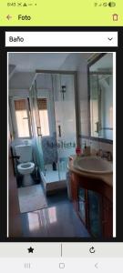 a bathroom with a tub and a sink and a toilet at villa Amparo in Villaviciosa de Odón