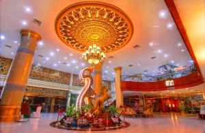 a large lobby with a chandelier in a building at Golden View Hotel in Nagoya