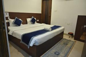 Voodi või voodid majutusasutuse Via Banarasi Kothi - Sankat Mochan Temple toas