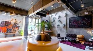 a living room with a couch and a table at The B Ranong Trend Hotel in Ranong