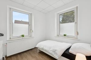 En eller flere senge i et værelse på Worker Place Bedburg Hau