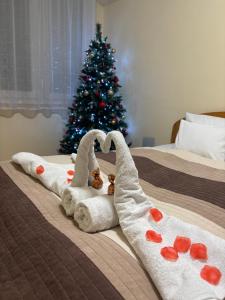 Postel nebo postele na pokoji v ubytování Zenora Apartman