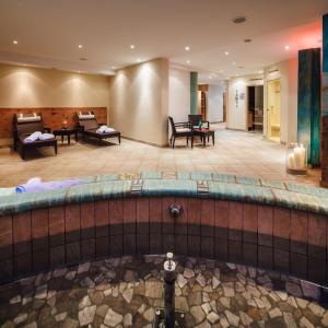 a pool in the lobby of a hotel at Bergkristall Ladis in Ladis