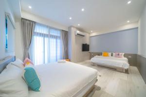 Postel nebo postele na pokoji v ubytování 愛旅行民宿 可包棟