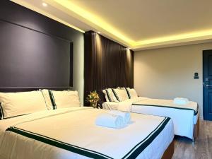 Ένα ή περισσότερα κρεβάτια σε δωμάτιο στο Thebed's Rojana