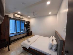 Ένα ή περισσότερα κρεβάτια σε δωμάτιο στο Urban Nest