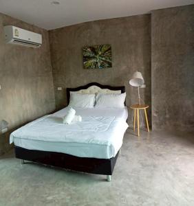 Ένα ή περισσότερα κρεβάτια σε δωμάτιο στο Chayapa Fang Hotel ชญาภาฝาง โฮเทล +25 φωτογραφίες