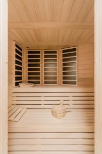 a sauna with wooden walls and a wooden ceiling at Holiday Home Pr'Lukčevih with 4 Bedrooms & Sauna in Kanal