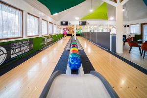 a bowling alley with a pin in the middle at Park Hotel Bükfürdő in Bük