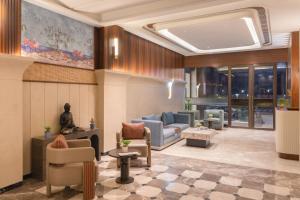 a lobby with couches and chairs in a building at Clarks Inn Kharar-Mohali in Kharar