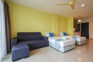 Et opholdsområde på Marina Island Lumut Homestay