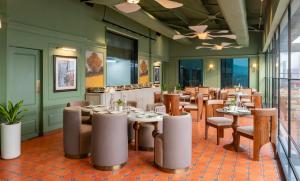 a dining room with tables and chairs at Clarks Inn Kharar-Mohali in Kharar