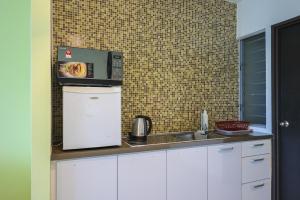 Køkken eller tekøkken på Marina Island Lumut Homestay + 7 billeder