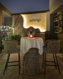 a table with wine glasses and a candle on it at Clarks Inn Kharar-Mohali in Kharar