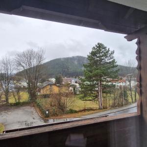 a window with a view of a town at Sankt Johannerhof in Ternitz