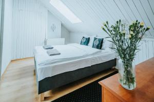 En eller flere senge i et værelse på Willa przy Krupówkach