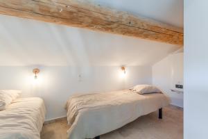 Giường trong phòng chung tại Canto Cigalo Duplex no 11