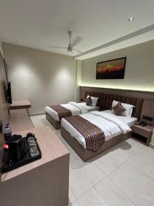Ένα ή περισσότερα κρεβάτια σε δωμάτιο στο Hotel The Royal Keshar