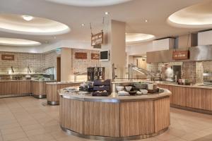 a restaurant with a kitchen with a counter top at Atlantica Aegean Park in Kolymbia