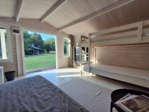 a large bedroom with a bed and a large window at Rannametsa puhkekeskus in Paope