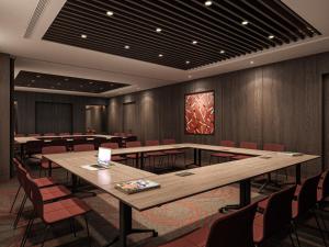 a conference room with tables and chairs in it at Ramada by Wyndham Arnavutkoy in Istanbul