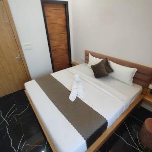 En eller flere senge i et værelse på Kasaara Retreat By Nexottel