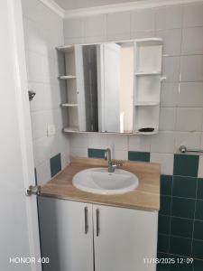 a bathroom with a sink and a mirror at Elixir Two Bed Rooms in Hurghada