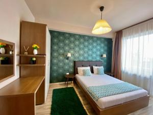 Giường trong phòng chung tại Summerland Nico