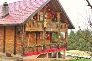 a model of a house with christmas decorations on it at Pine House - Holiday Home in Banja Luka +10 photos