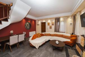 a living room with a couch and a table at Pelion Horizon in Zagora